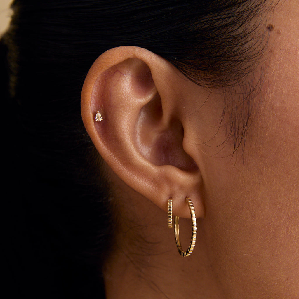 White Topaz Pear Piercing Stud in Solid Gold