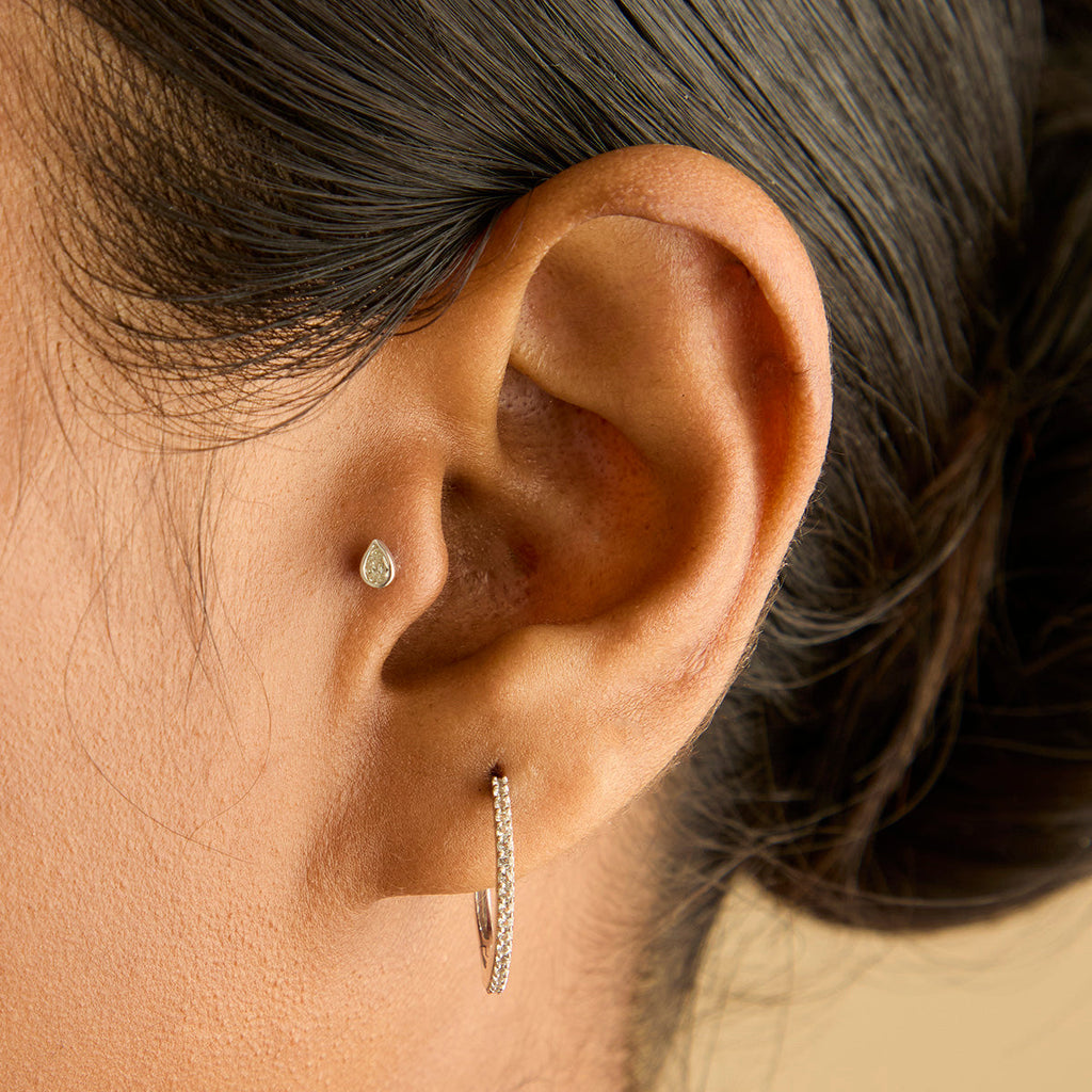 Diamond Bezel Pear Piercing Stud in Solid White Gold