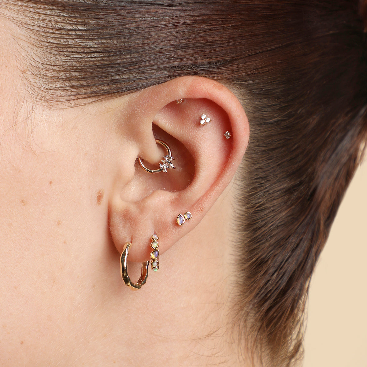 Opal Pear Bezel Huggies in Solid Gold