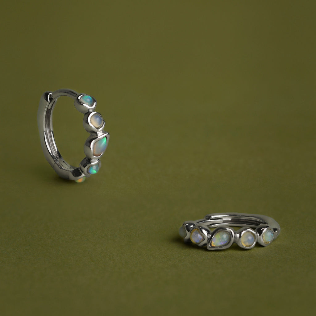 Opal Pear Bezel Huggies in Solid White Gold
