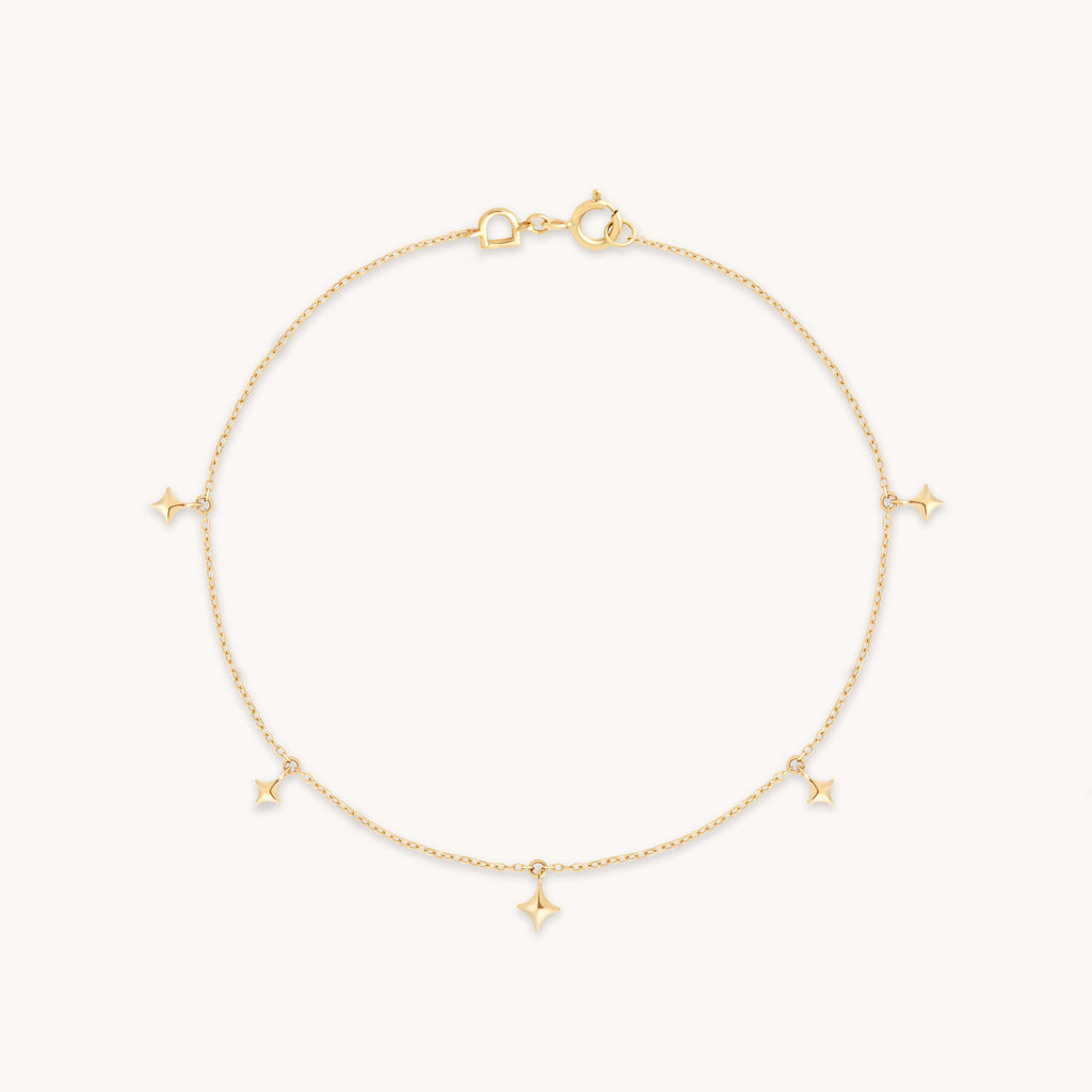 Cosmic Star Charm Bracelet in Solid Gold