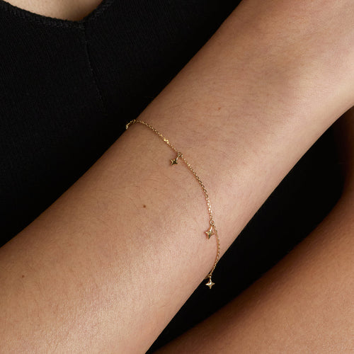 Cosmic Star Charm Bracelet in Solid Gold