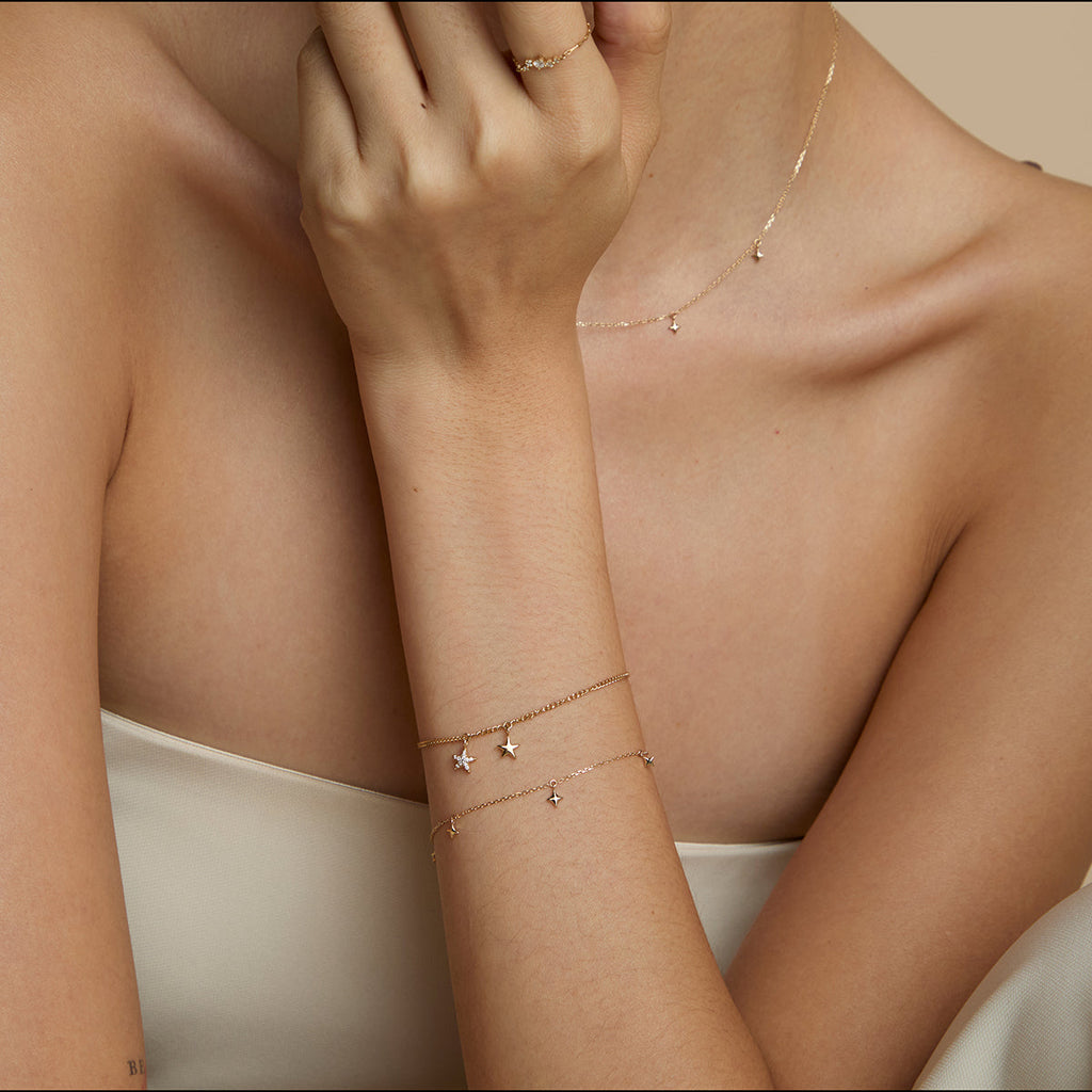 Cosmic Star Charm Bracelet in Solid Gold