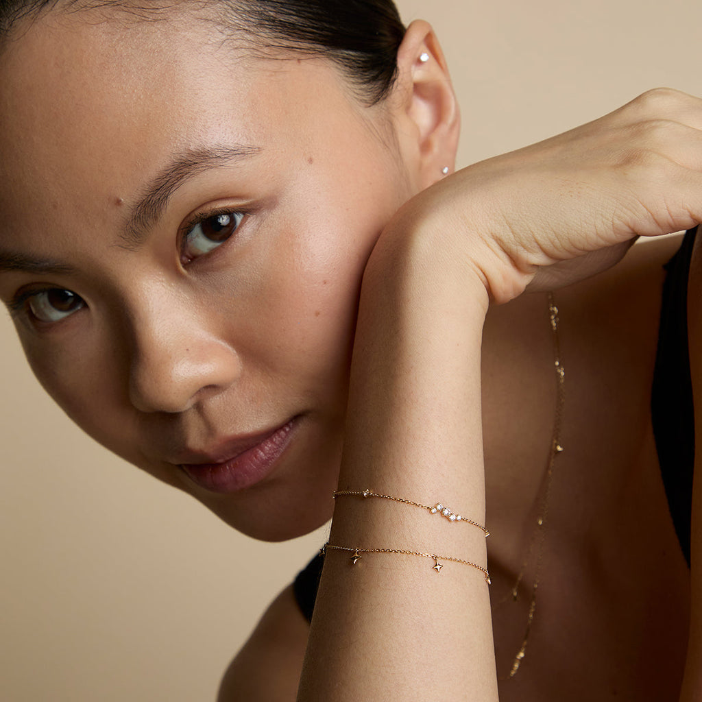 Cosmic Star Charm Bracelet in Solid Gold